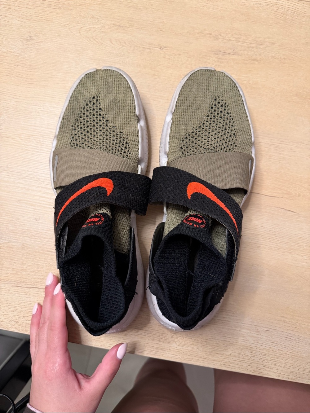 Nike Kids Olive Green Slip-On Sneakers with Black Strap and Orange Swoosh